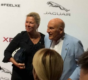 Sir Stirling Moss arriving at Earl's Court with wife, Susie.