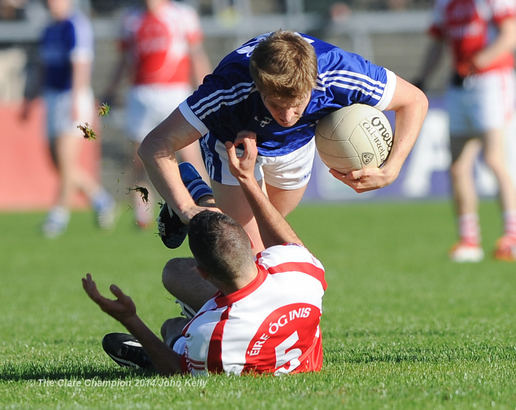 Podge Collins of Cratloe in action against Dean Ryan of Eire Og during their senior football final at Cusack park. Photograph by John Kelly.