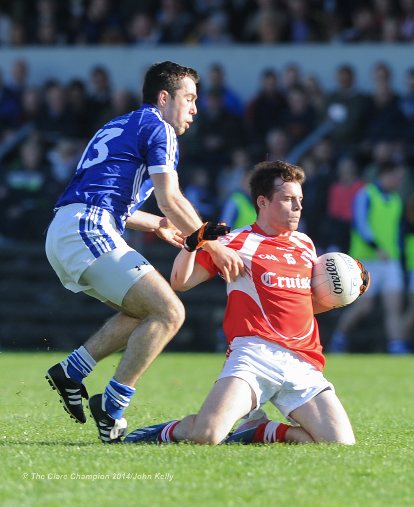 Conor Mc Grath of Cratloe in action against Eimhin Courtney of Eire Og during their senior football final at Cusack park. Photograph by John Kelly.