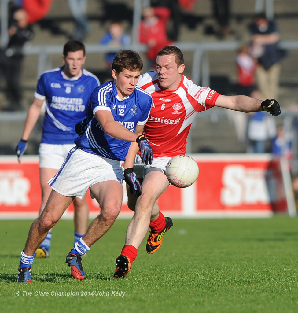 Liam Markham of Cratloe in action against Shane Daniels of Eire Og during their senior football final at Cusack park. Photograph by John Kelly.