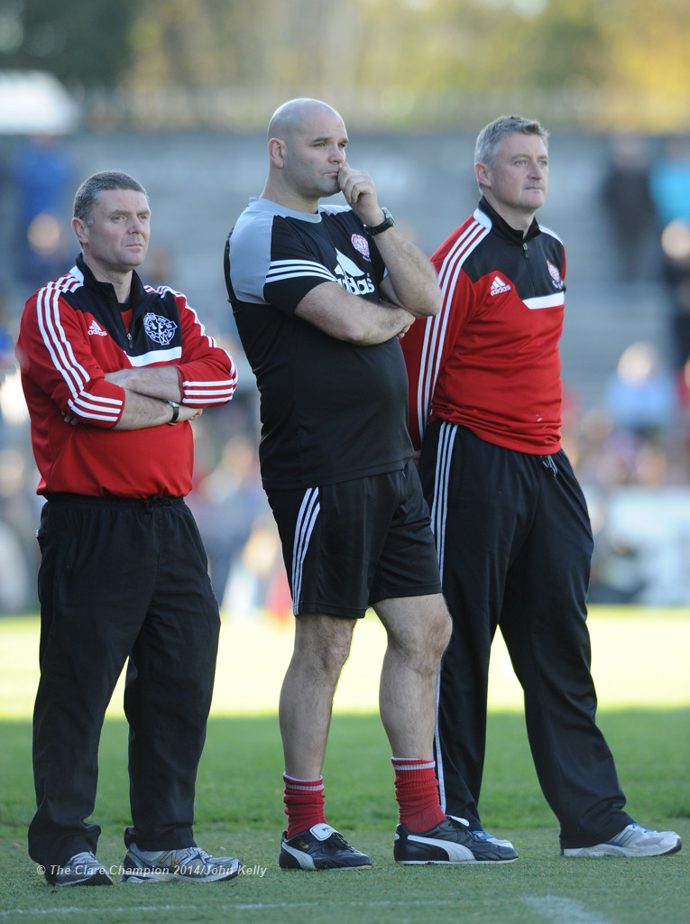 Eire Og manager James Hanrahan, right, and selectors Mattie Murphy and Cathal Shannon can only look on during the closing stages of their senior football final at Cusack park. Photograph by John Kelly.