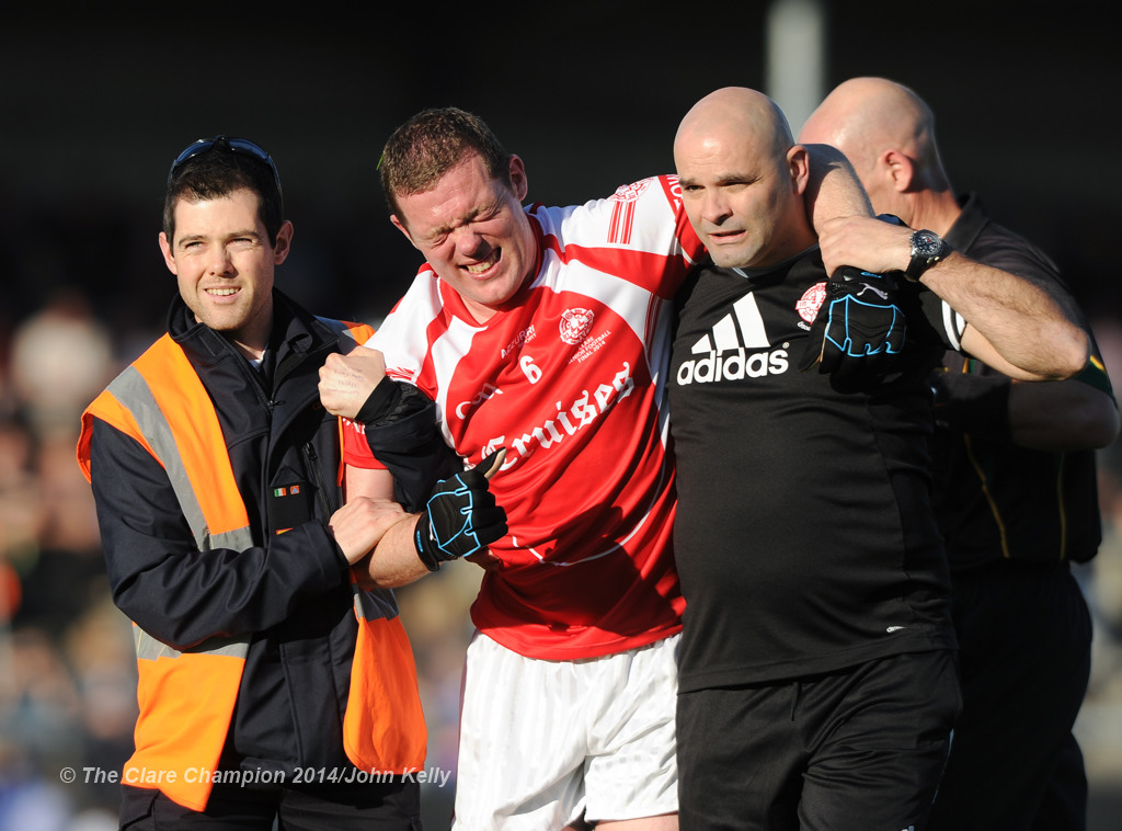 Shane Daniels of Eire Og is taken off injured near the end of their senior football final at Cusack park. Photograph by John Kelly.