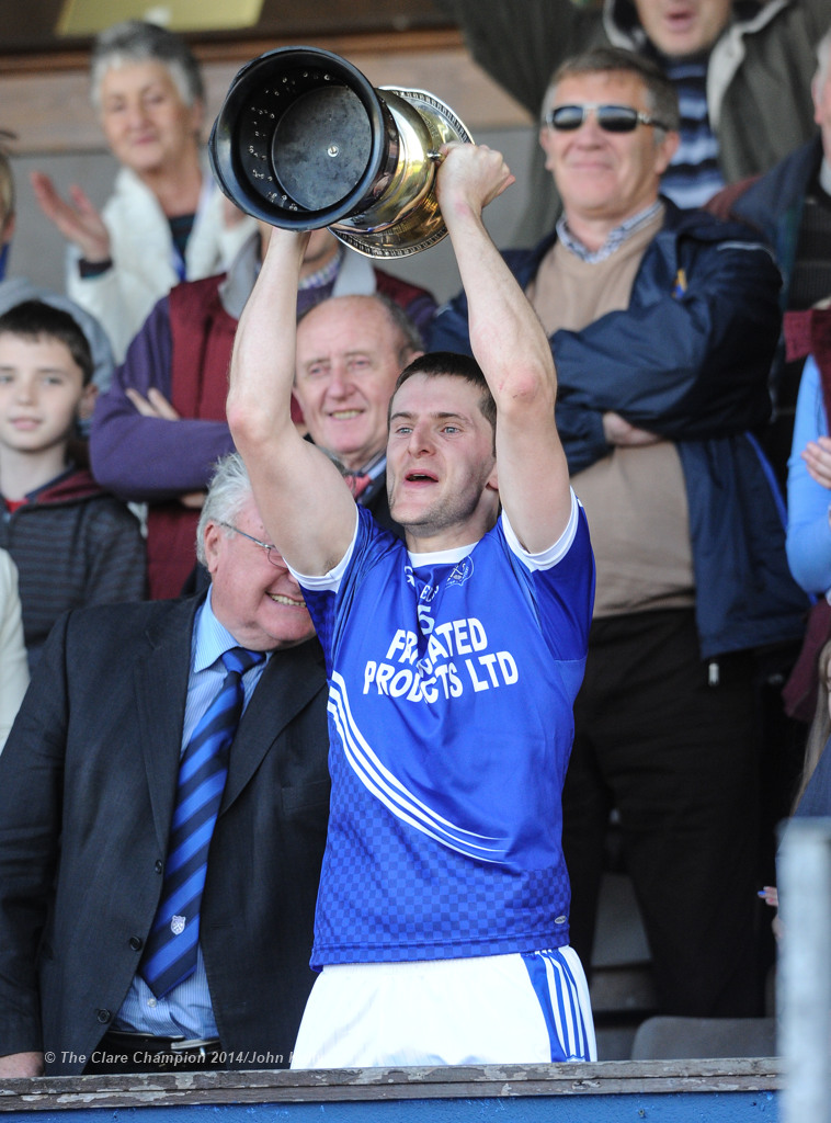 Micheal Hawes of Cratloe lifts the cup following their senior football final win over Eire Og at Cusack park. Photograph by John Kelly.