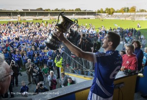 The Cratloe crowd look on as captain Micheal Hawes of  lifts the cup following their senior football final win over Éire Óg. Photograph by John Kelly.