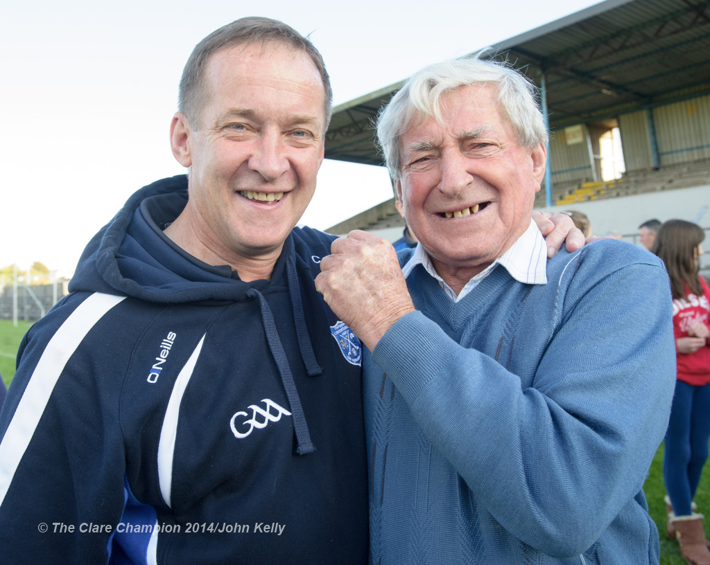 Cratloe manager Colm Collins is congratulated by his dad Cyril following the win over Eire Og in their senior football final at Cusack park. Photograph by John Kelly.