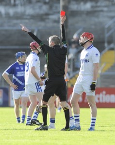 Denis Maher of Thurles Sarsfield's gets sent off by the referee Cathal Mc Allister early on during their Munster Club quarter final in Cusack park. Photograph by John Kelly.