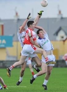 Liam Corry of Eire Og in action against Cian O Dea and Paul Carkill of Clann Lir during the  U-21A final in Miltown Malbay. Photograph by John Kelly.