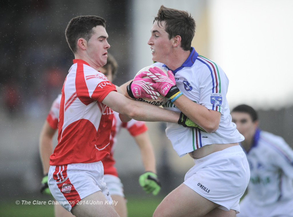 Liam Corry of Eire Og in action against Paul Carkill of Clann Lir during the  U-21A final in Miltown Malbay. Photograph by John Kelly.