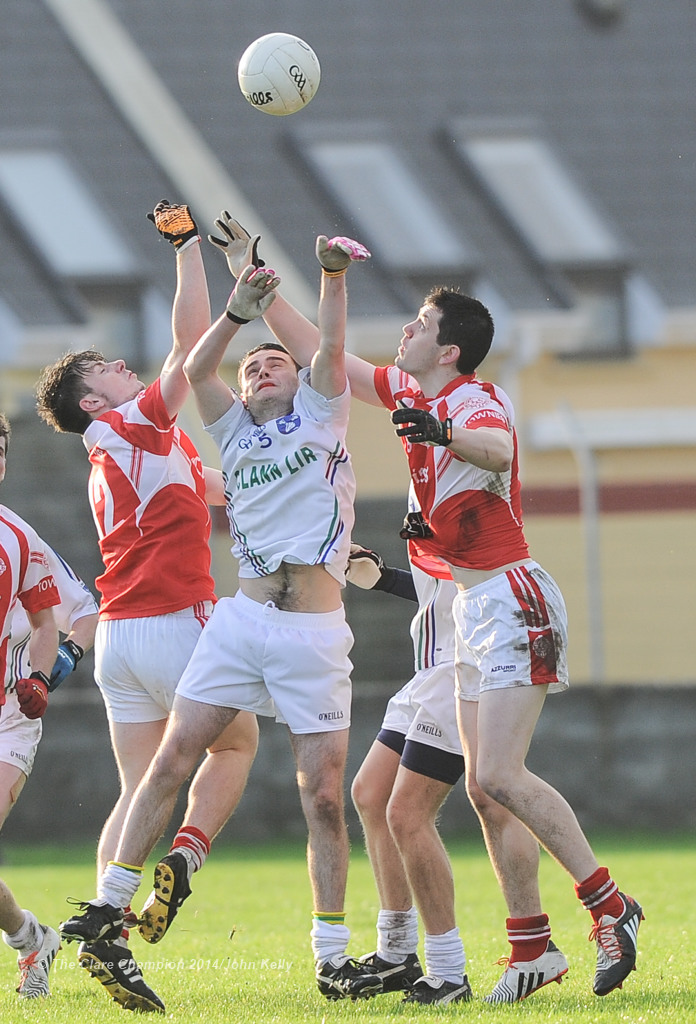 David Mc Namara of Clann Lir in action against Conor O Halloran and Cian Darcy of Eire Og during the  U-21A final in Miltown Malbay. Photograph by John Kelly.