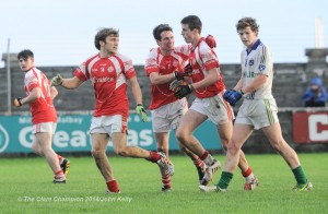 Dara Walsh of Eire Og is congratulated for a goal against Clann Lir during the  U-21A final in Miltown Malbay, by team mates Shane O Donnell and Paddy O Malley. Photograph by John Kelly.