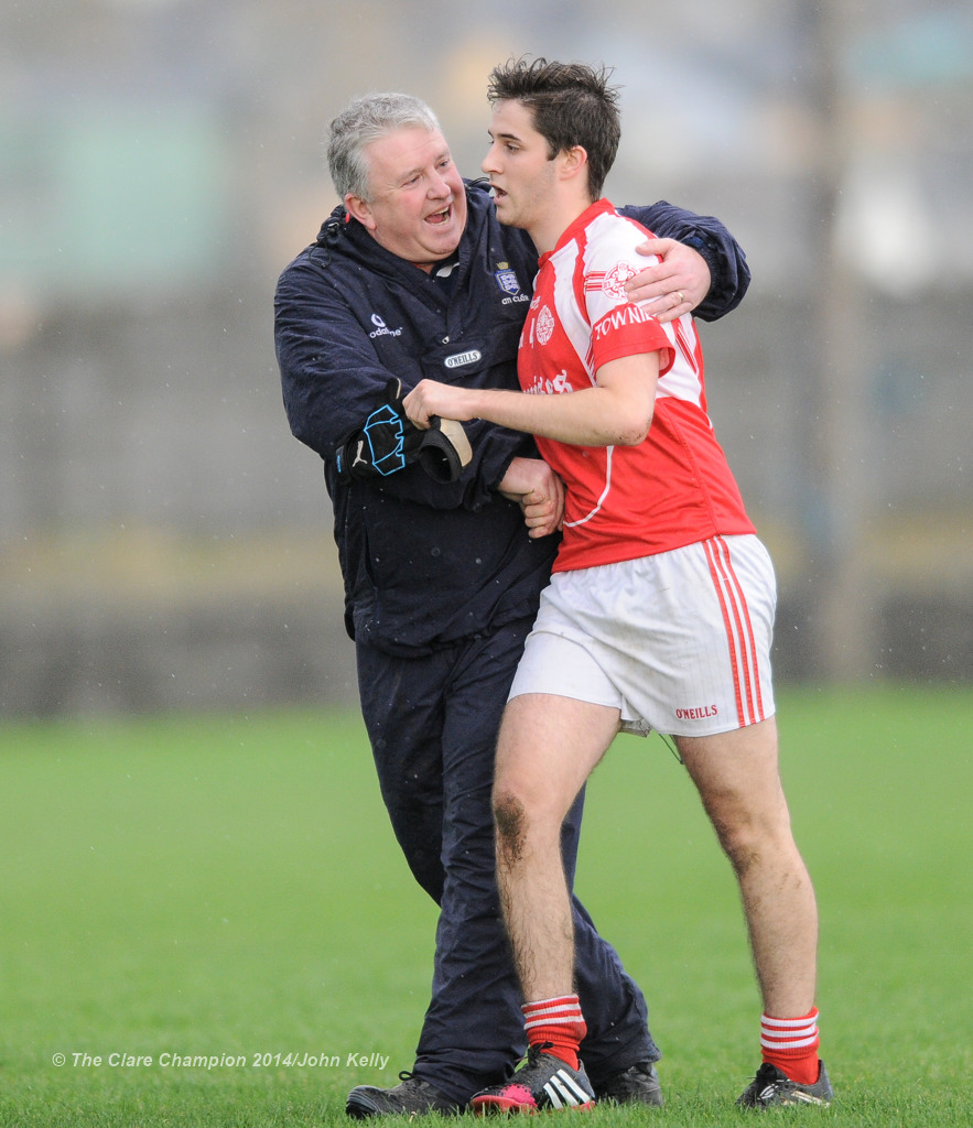 Dean D'Auria of Eire Og is congratulated by management Maurice Walsh as he is substituted late in the  U-21A final in Miltown Malbay. Photograph by John Kelly.