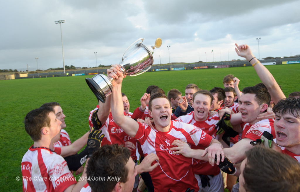 The Eire Og team captain Conor Brennan and his team mates celebrate with the John Marrinan Cup after beating Clann Lir in the  U-21A final in Miltown Malbay. Photograph by John Kelly.