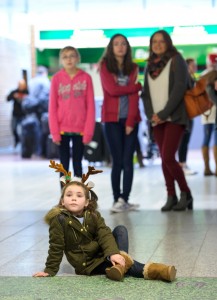 Young Keelan Kennedy from Adare patiently waits for her auntie Niamh Kennedy to arrive home for Christmas off the Heathrow flight. Photograph by John Kelly.