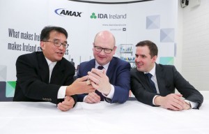 From left: Allen Lee, vice president of operations, AMEX showing a picture of hid granddaughter to Minister for Business & Employment, Ged Nash and Martin Shanahan, CEO IDA at the official opening of AMEX. Photograph by Brian Gavin Press 22