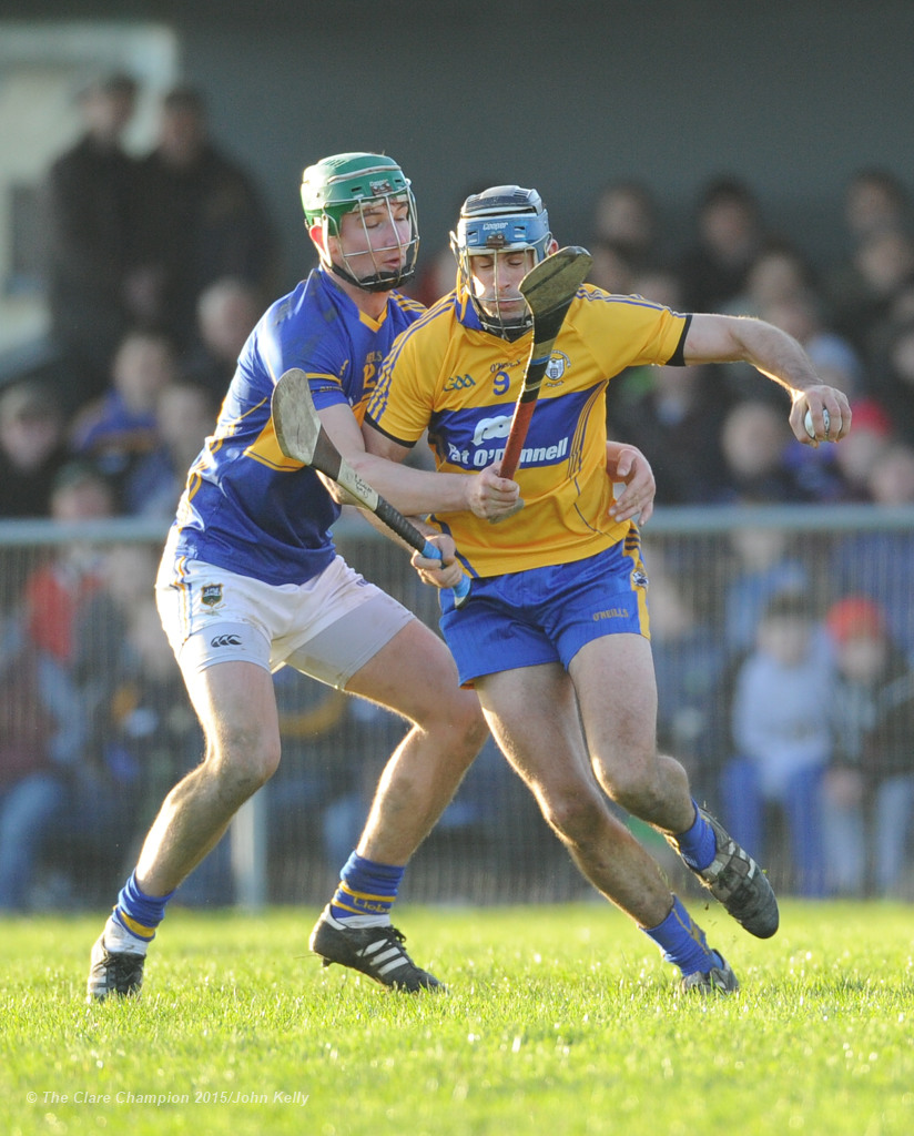 Brendan Bugler of Clare in action against Conor Kenny of Tipperary during their Waterford Crystal Cup game at Sixmilebridge. Photograph by John Kelly.