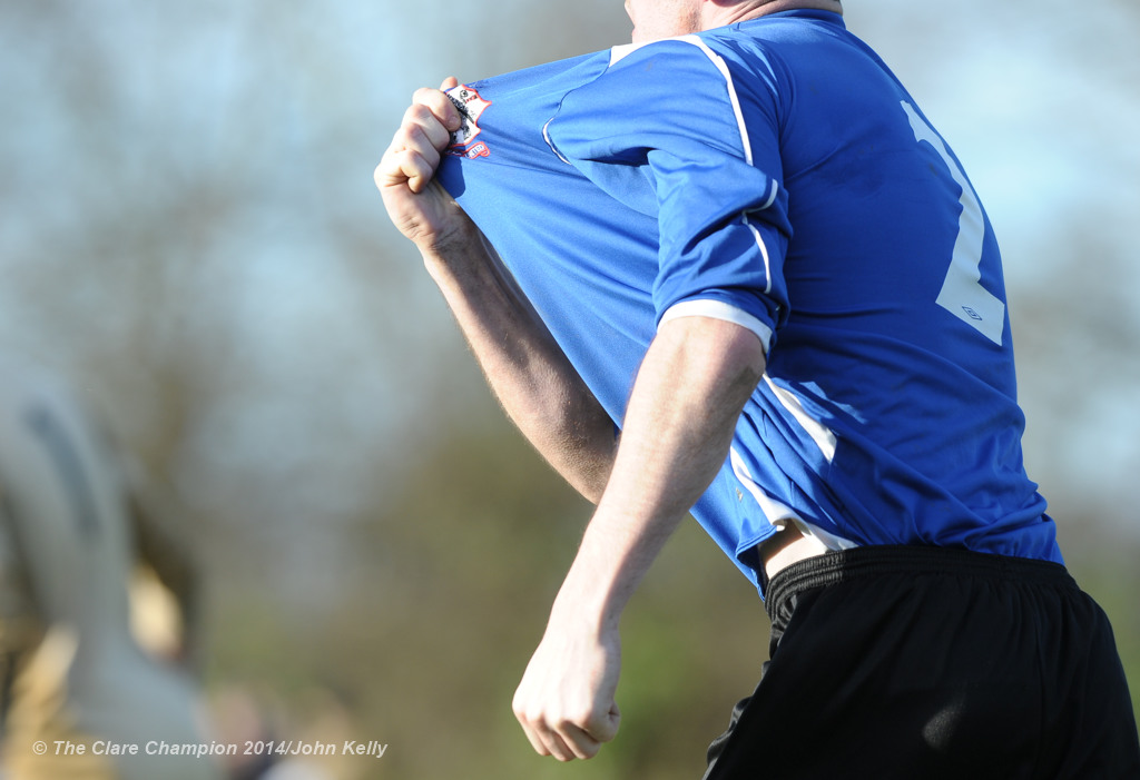 A delighted Jason Whyte of Bridge United grasps his jersey's crest after scoring a late equaliser against Newmarket Celtic during their top of the table Premier League clash at Newmarket. Photograph by John Kelly.