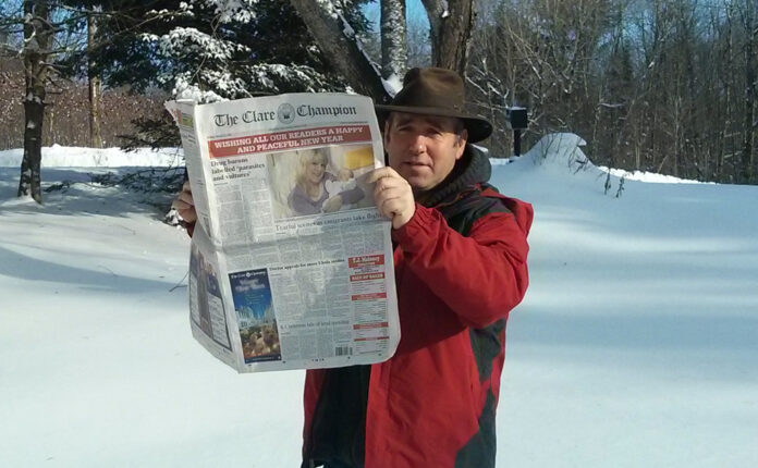 Martin McDonnell, originally from Kilkee, enjoys a read of The Clare Champion in snowy Ontario.