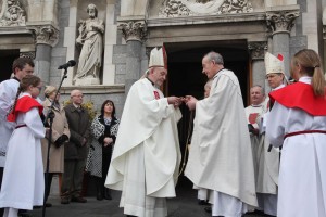  Archbishop Kieran being presented with a crucifix by Fr Christy O'Dwyer,  Dean of the Chapter,  as a sign that he is being entrusted with the pastoral care of the Church of Cashel and Emly at the door of the cathedral before the ceremonial installation. Photograph by John McElroy