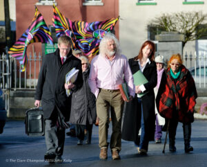 T.D's Mick Wallace and Claire Daly arriving with supporters at Ennis courthouse on Tuesday morning. Photograph by John Kelly.