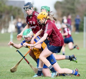 St Flannan's Zoe McInerney feels the pressure from Seamount's Niamh Murphy and Ciara Murphy in Gort on Saturday. Photograph by Arthur Ellis.