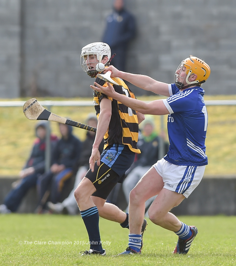 Francis McCormack of Crusheen-Tubber  in action against Shane Gleeson of Cratloe  during their U-21 semi final at Clarecastle. Photograph by John Kelly.