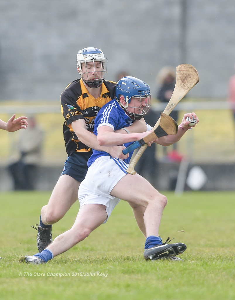 Youen Horner of Crusheen-Tubber  in action against Conor Crosby of Cratloe  during their U-21 semi final at Clarecastle. Photograph by John Kelly.