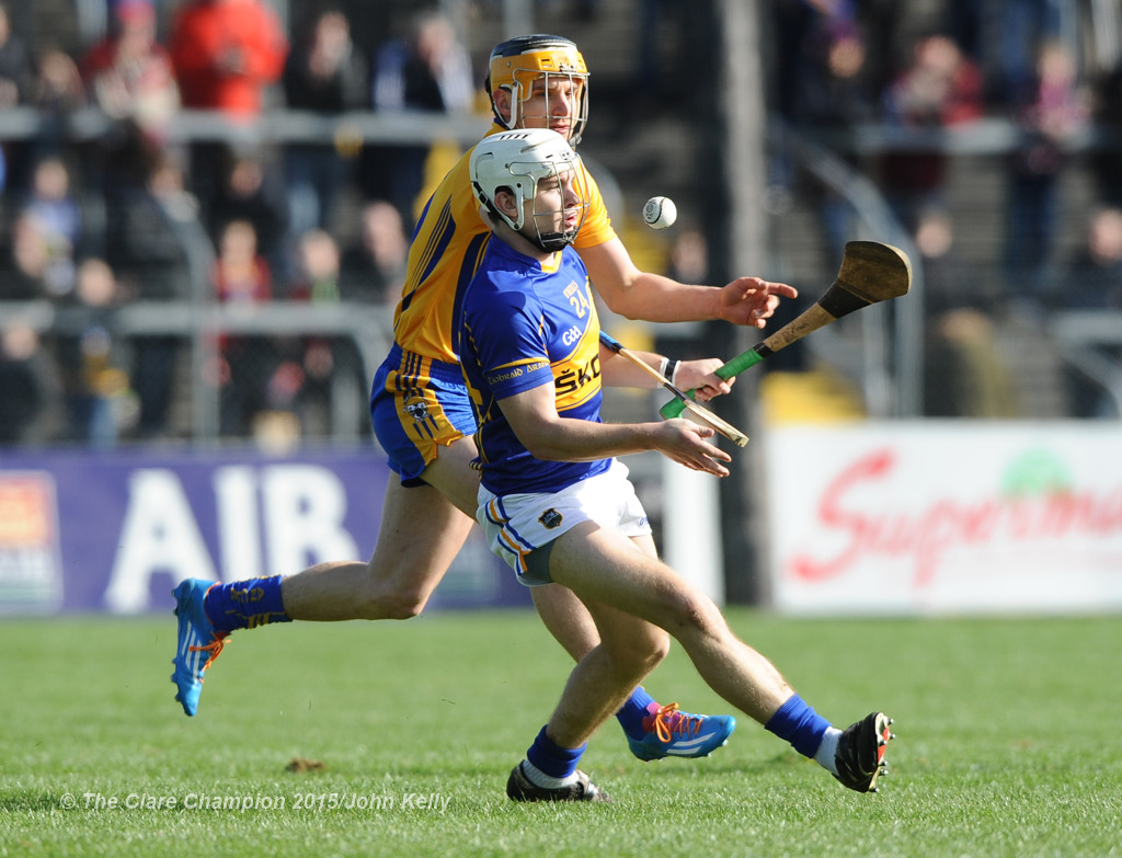 Niall O Meara of Tipperary in action against John Conlon of Clare during their game in Cusack park. Photograph by John Kelly.