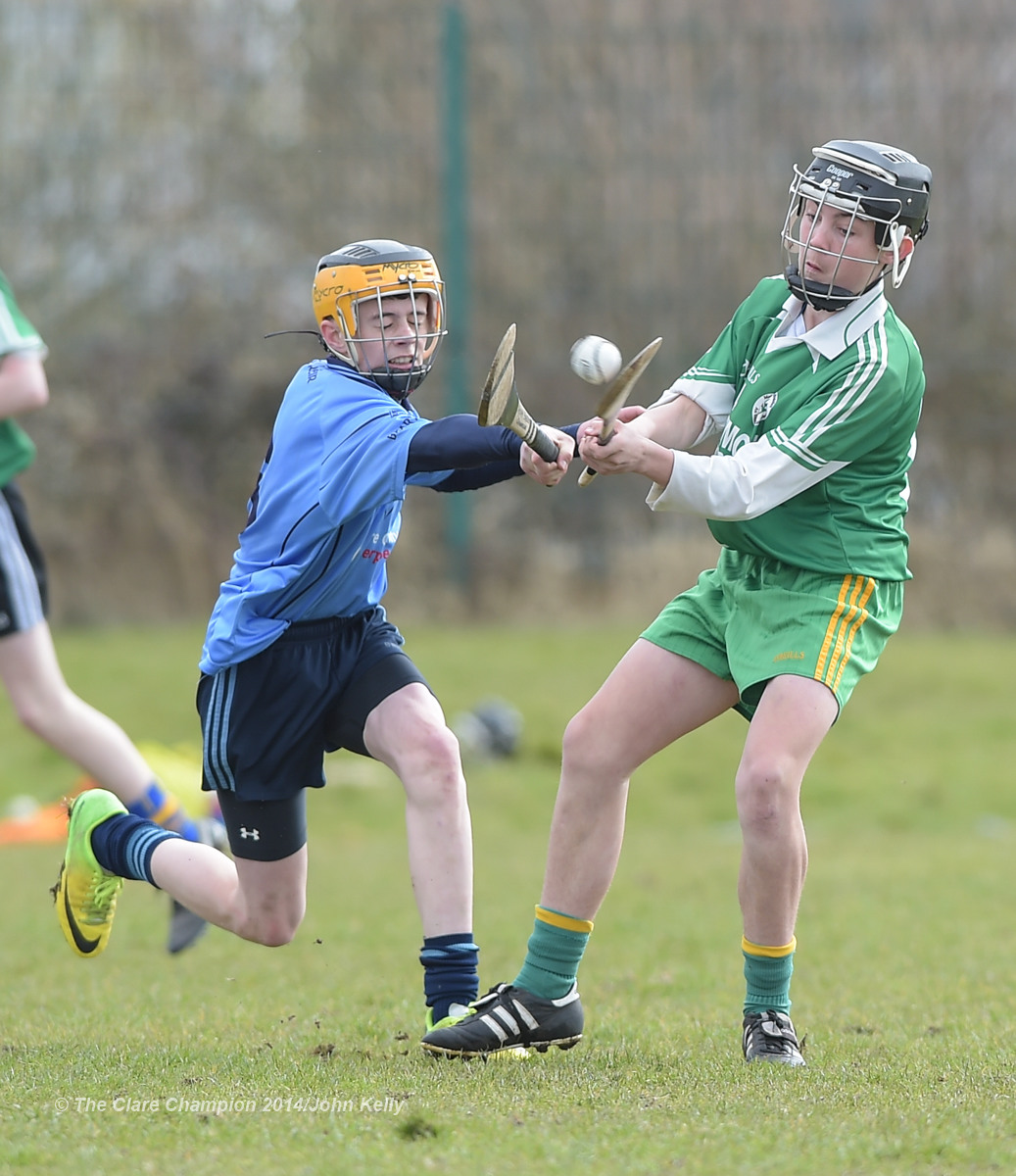 Aidan Sheedy of Scariff Community College  in action against Keelin Guiler of Ennistymon CBS during their Munster U-15 D final at Clarecastle. Photograph by John Kelly.