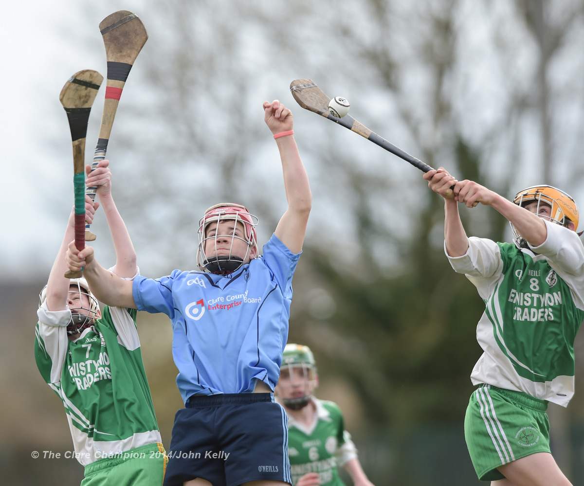 Conor Downes of Scariff Community College  in action against Cormaic Devitt and Aidan Mc Carthy of Ennistymon CBS during their Munster U-15 D final at Clarecastle. Photograph by John Kelly.