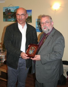 Cathaoirleach of Clare County Council, Councillor John Crowe, right, presents Mayor Yves Dauvé with the County Clare coat of arms.