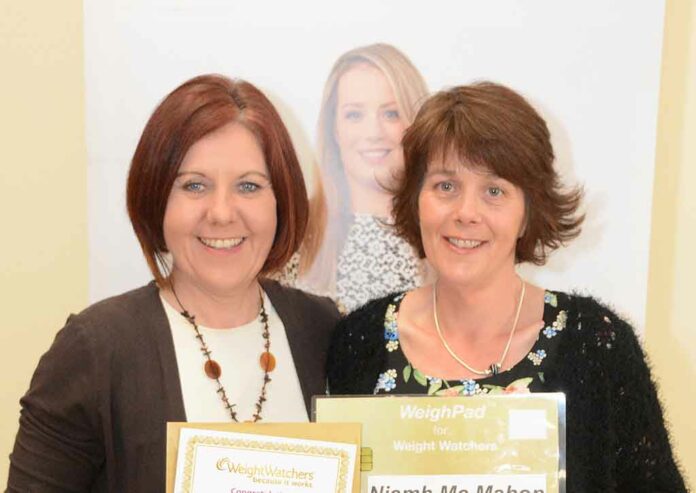 Niamh McMahon receives her Gold cert from Weightwatcher leader, Kathleen Shannon, after maintaining her goal weight for four weeks.