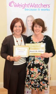 Niamh McMahon receives her Gold cert from Weightwatcher leader, Kathleen Shannon, after maintaining her goal weight for four weeks.