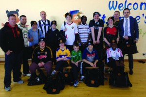 Students of St Anne's with their new gear from Ennis RFC's Donal McMahon and Tommy Lees of TTM Healthcare.