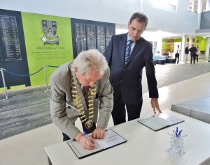  James Breen, Cathaoirleach of Clare County Council, and Gerard Dollard, director of services, sign the Books of Condolences at Áras Contae an Chláir