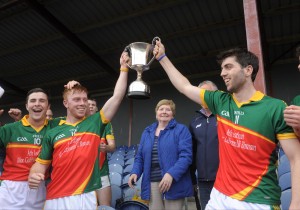 Broadford Smith O Brien's Mikey O Shea and Sean Phelan lift the cup following their win over Wolfe Tones in the Minor A Hurling final in Sixmilebridge. Photograph by John Kelly.