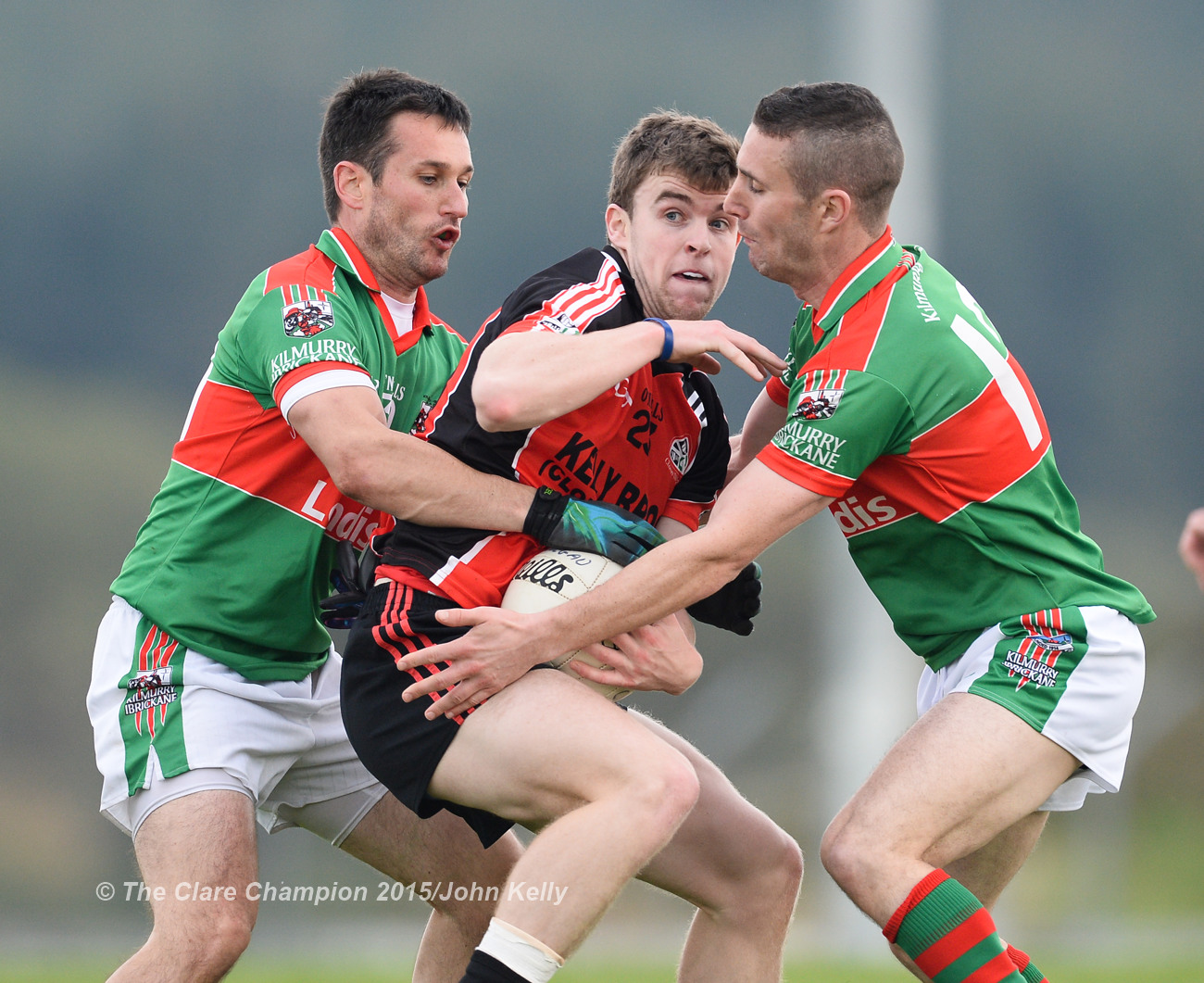 Tony Kelly of Clondegad in action against Michael O Dwyer and Shane Hickey of Kilmurry Ibrickane during their Cusack Cup final in Kilmihil.