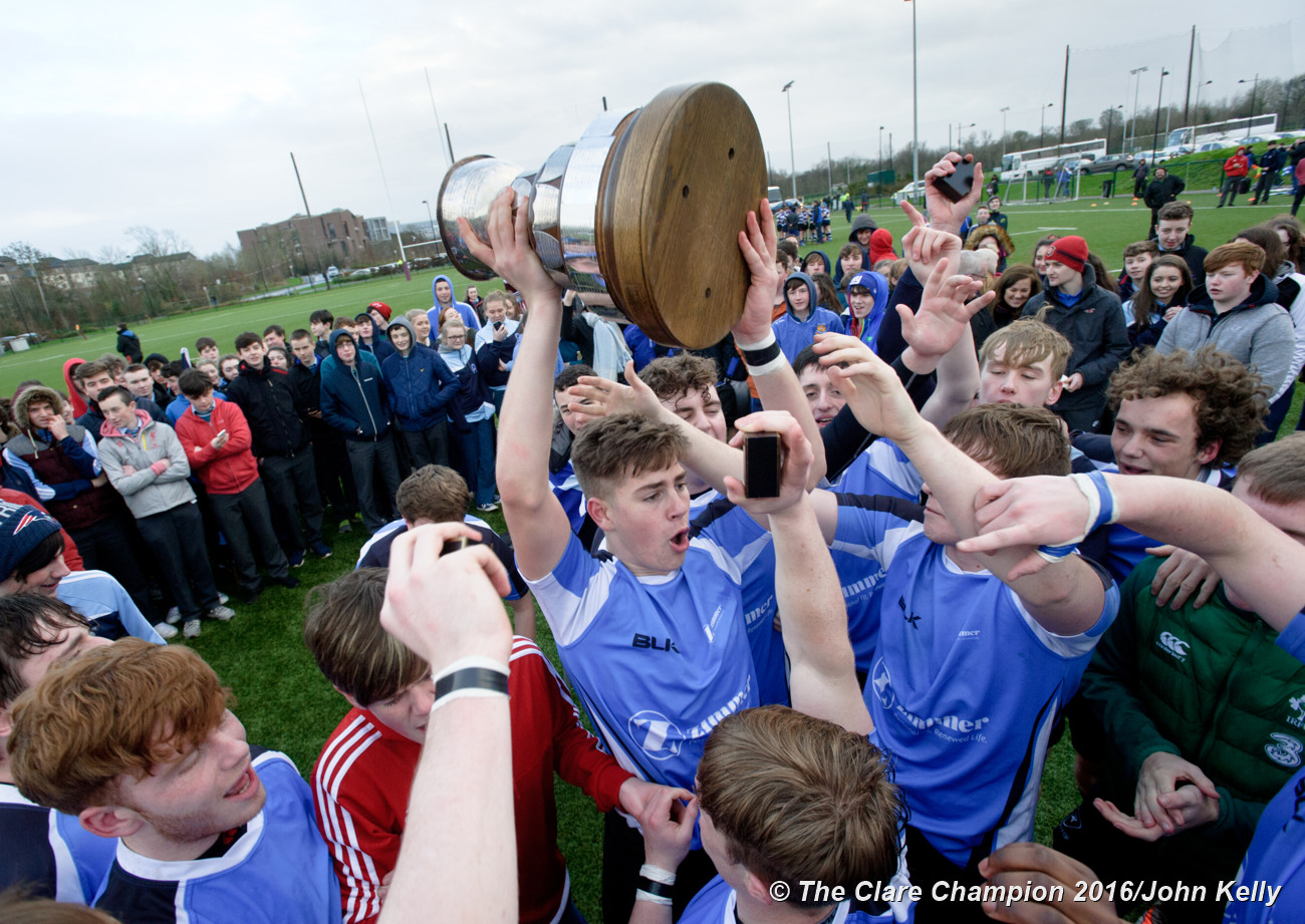 Player Alex Blake and St Caimins team mates celebrate with the cup following their win over Abbey CBS.