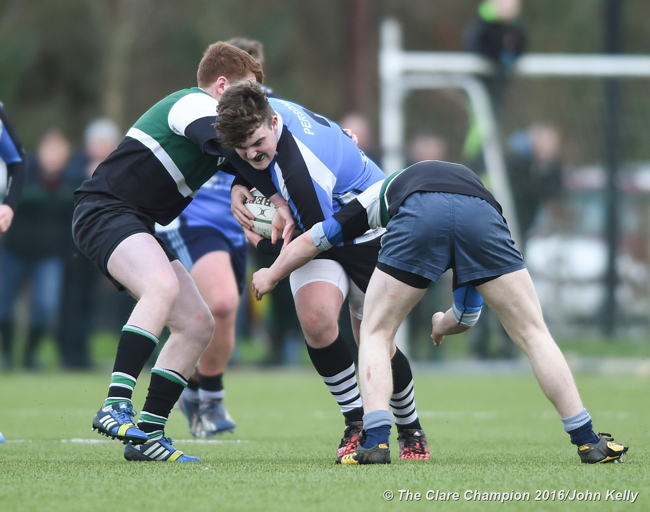 Evan O Gorman of St Caimins in action against Gavin Mc Cormack and Eoin Kelly of Abbey CBS.