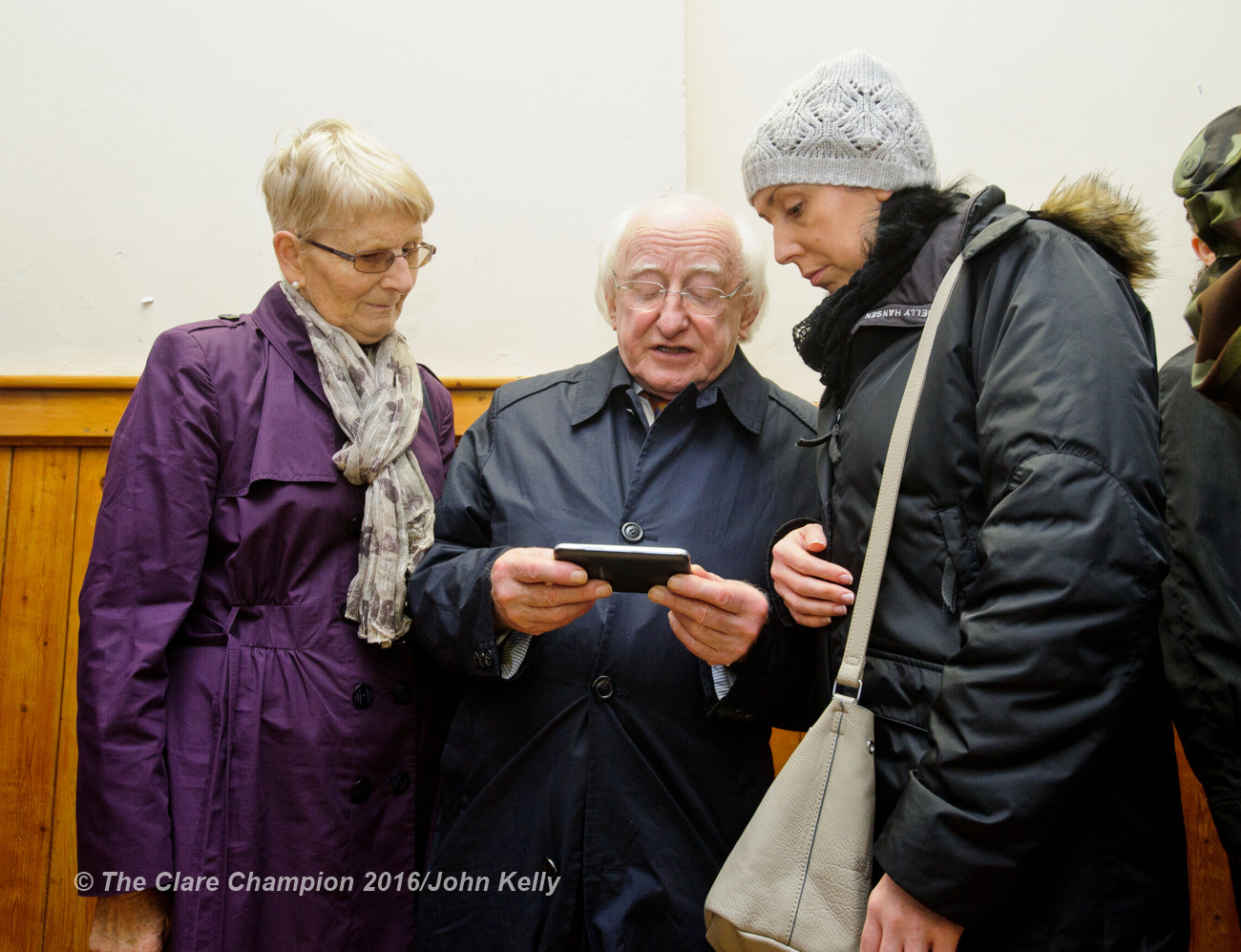 President Michael D Higgins chatting with Sarah Burke and her mother-in-law Sheila Burke of Cahermore, Kinvarra, who have houses affected by flooding during his visit to Labane to meet the victims of flooding in the area. Photograph by John Kelly.