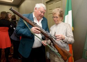 Pat Kirby and Nora O'Brien, daughter of volunteer John O'Brien, looking at an old gun. Photograph by John Kelly.