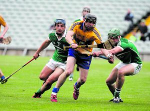 Clare’s Michael O’Neill battles with Mike Casey and Andrew La Touche Cosgrave. 