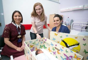 Dr Naro, Jennifer Clary, CEO Baby Box, and Lisa Healy with her newborn daughter, Leah in the box Photogaph by Arthur Ellis