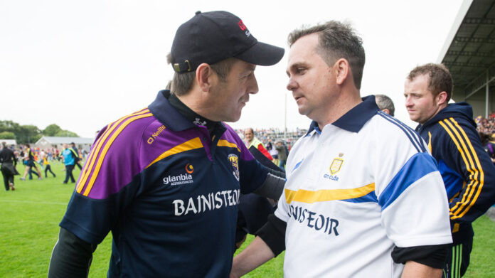 Wexford manager Liam Dunne and former Clare manager Davy Fitzgerald following their All-Ireland qualifier replay at Wexford Park in 2014. Photograph by John Kelly.