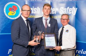 Simon Coveney TD, Minister for Housing, Planning & Local Government presents the Sports Persons of the Year Award to Bernard Cahill (22) from Ennis flanked by Seamus O'Neill, Chairman of the IWS Sports Commission at the annual Irish Water Safety Awards held at Dublin Castle. 