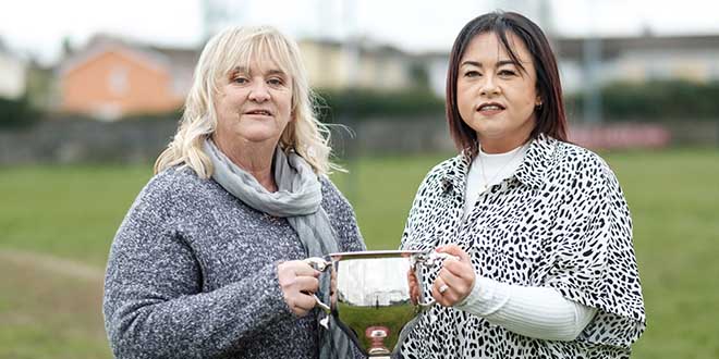 Tina Kenneally and Fiona Moloney, mothers of Shay and Jack holding the new rugby cup at the Ennis Rugby Club. Photograph by Paul Corey.