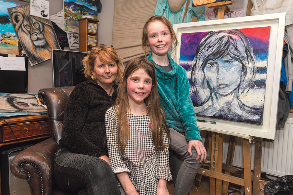 Carmel Doherty of Ennis Art School with two of her young proteges Laurie Hehir and her sister Honor. Laurie was the youngest prize winner in the 2019 Texaco Children’s Art Competition.