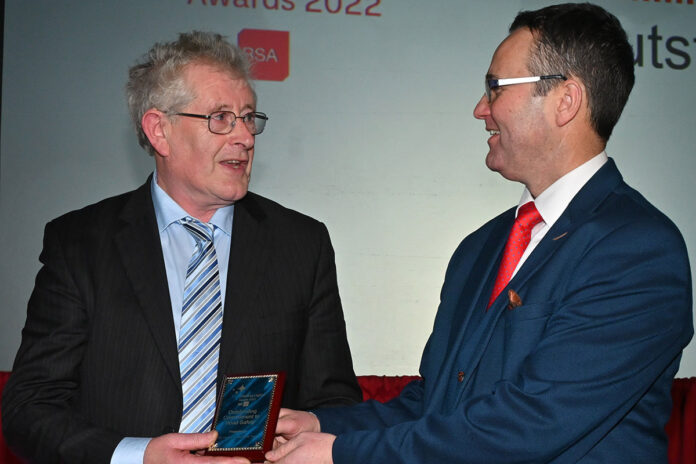 Pat Foudy receives his award from the Chief Executive of the RSA, Sam Woods.