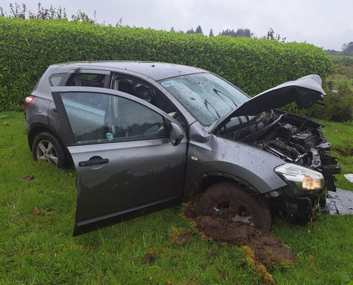 The remains of the Nissan Qashqai in a front garden.